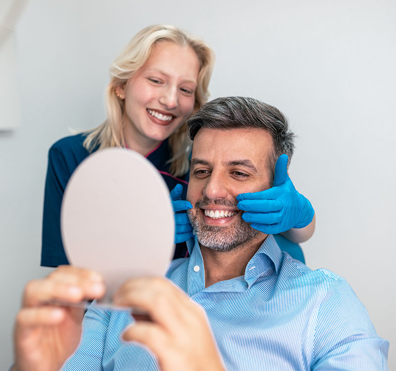 Patient receiving restorative dentistry consultation in Deerfield Beach dental office