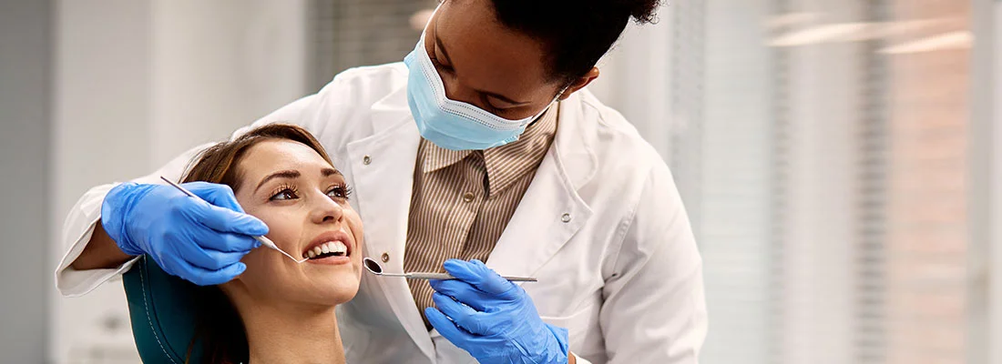 Dentist showing patient tooth restoration options.