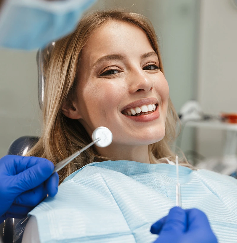 Patient receiving professional teeth whitening treatment in Deerfield Beach dental office